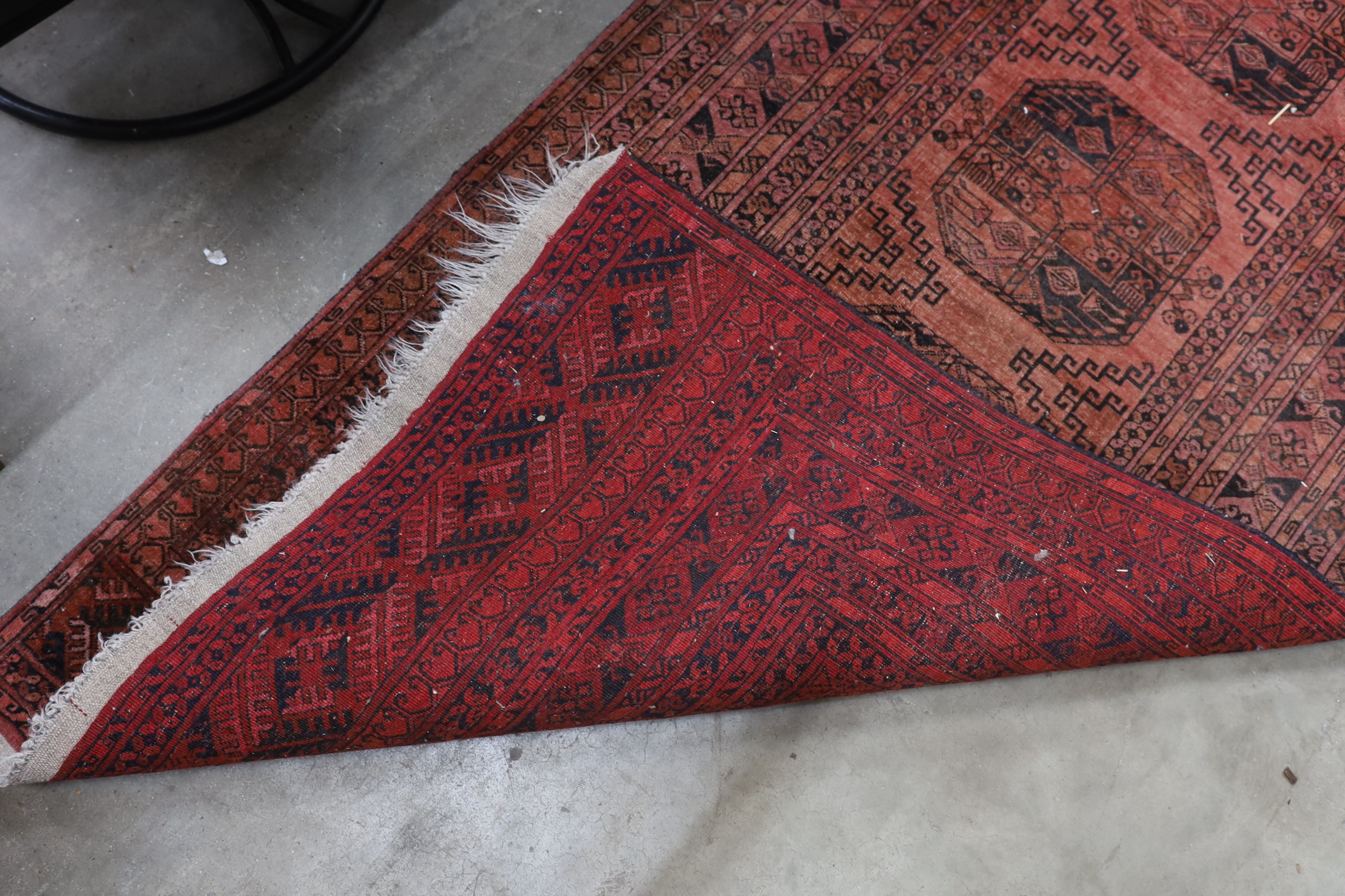 An antique Tekke rug 138cm x 66cm and an Afghan runner 280cm x 104cm.